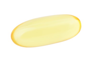 Photo of One yellow vitamin capsule isolated on white, top view