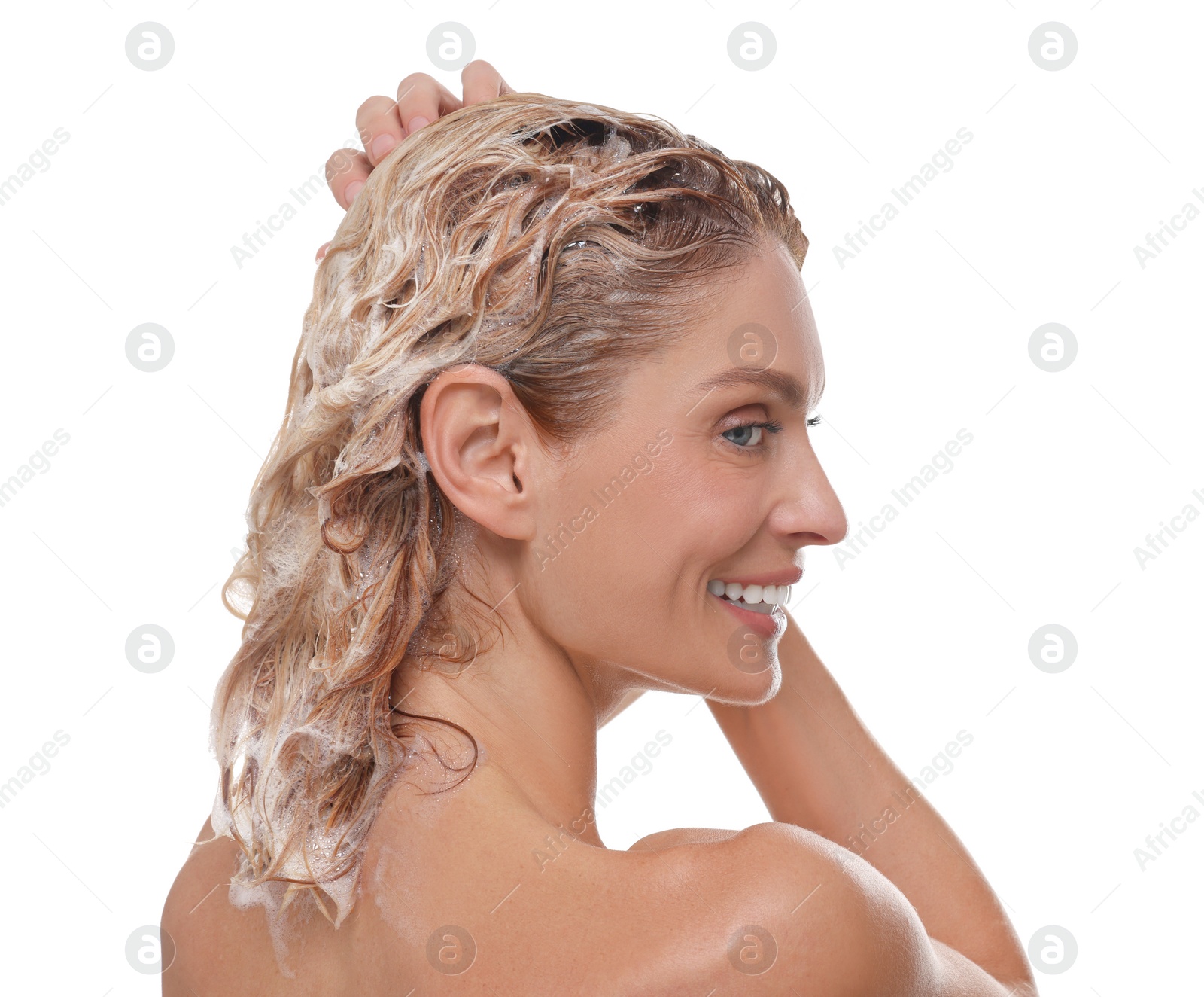 Photo of Beautiful happy woman washing hair on white background