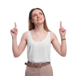 Photo of Beautiful businesswoman pointing at something against white background