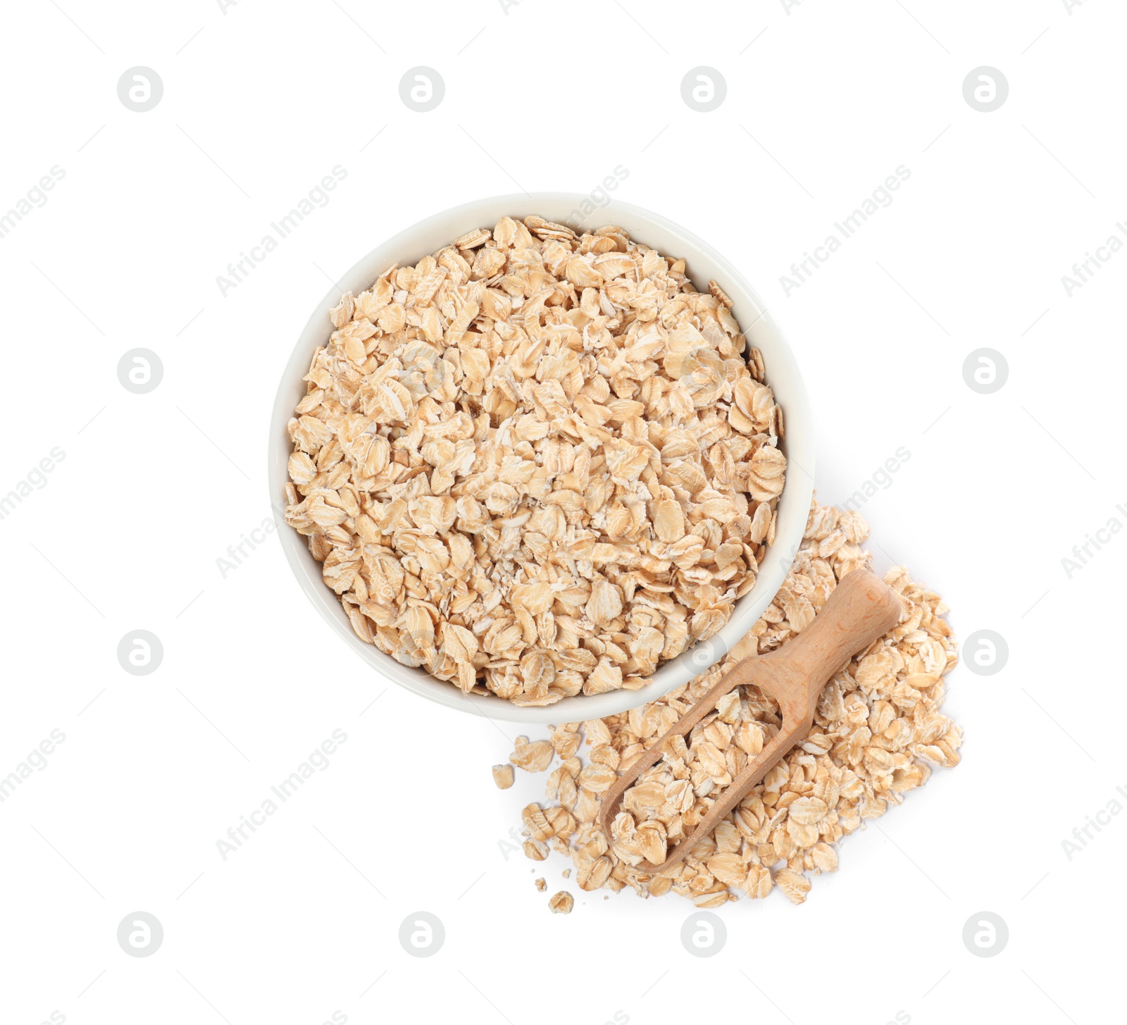 Photo of Bowl and scoop with oatmeal isolated on white, top view