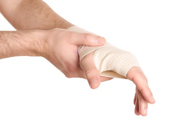 Photo of Man with hand wrapped in medical bandage on white background, closeup