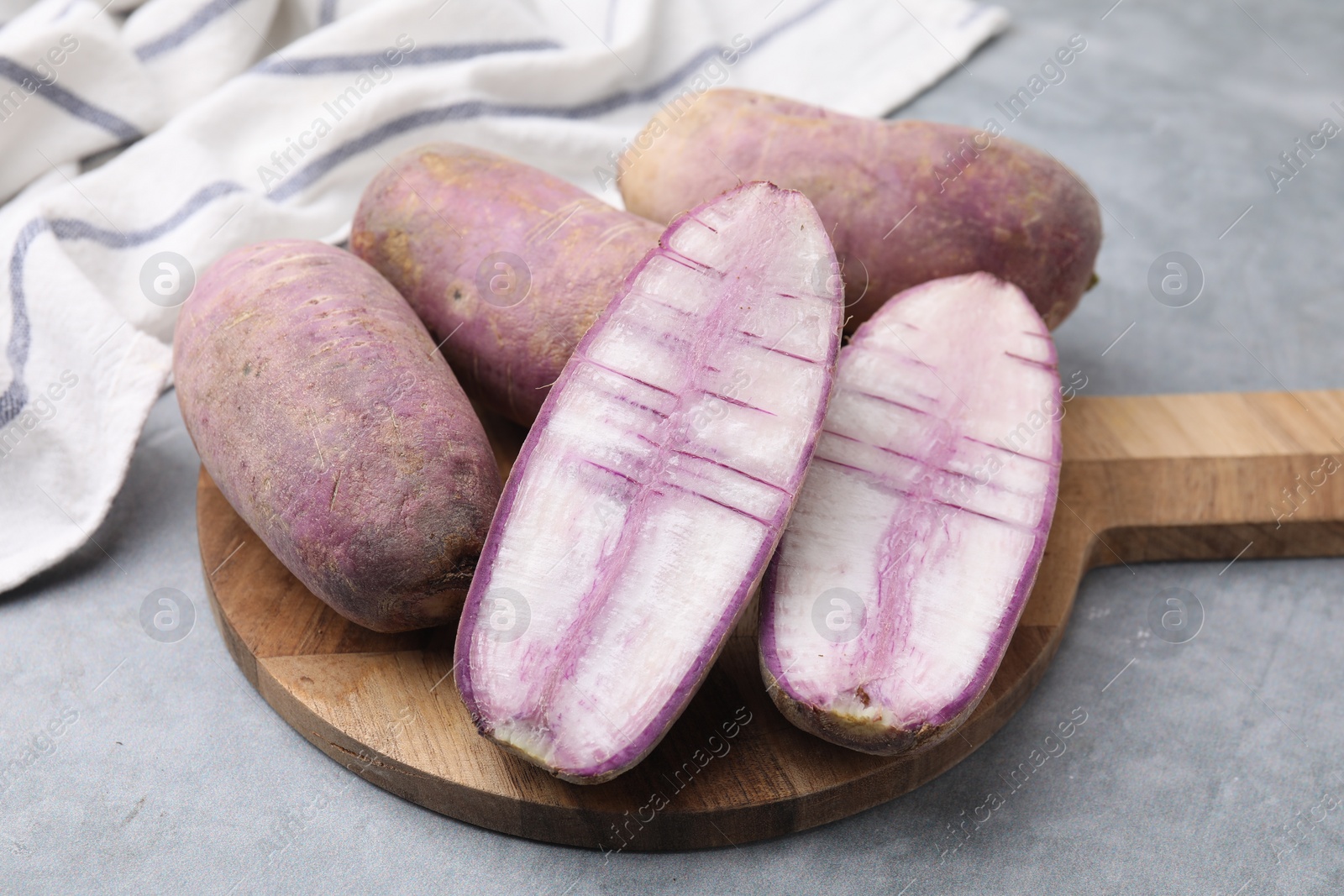 Photo of Purple daikon radishes on light grey table