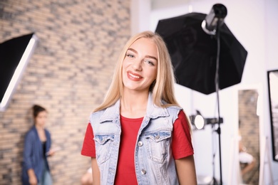 Photo of Beautiful young woman in photo studio