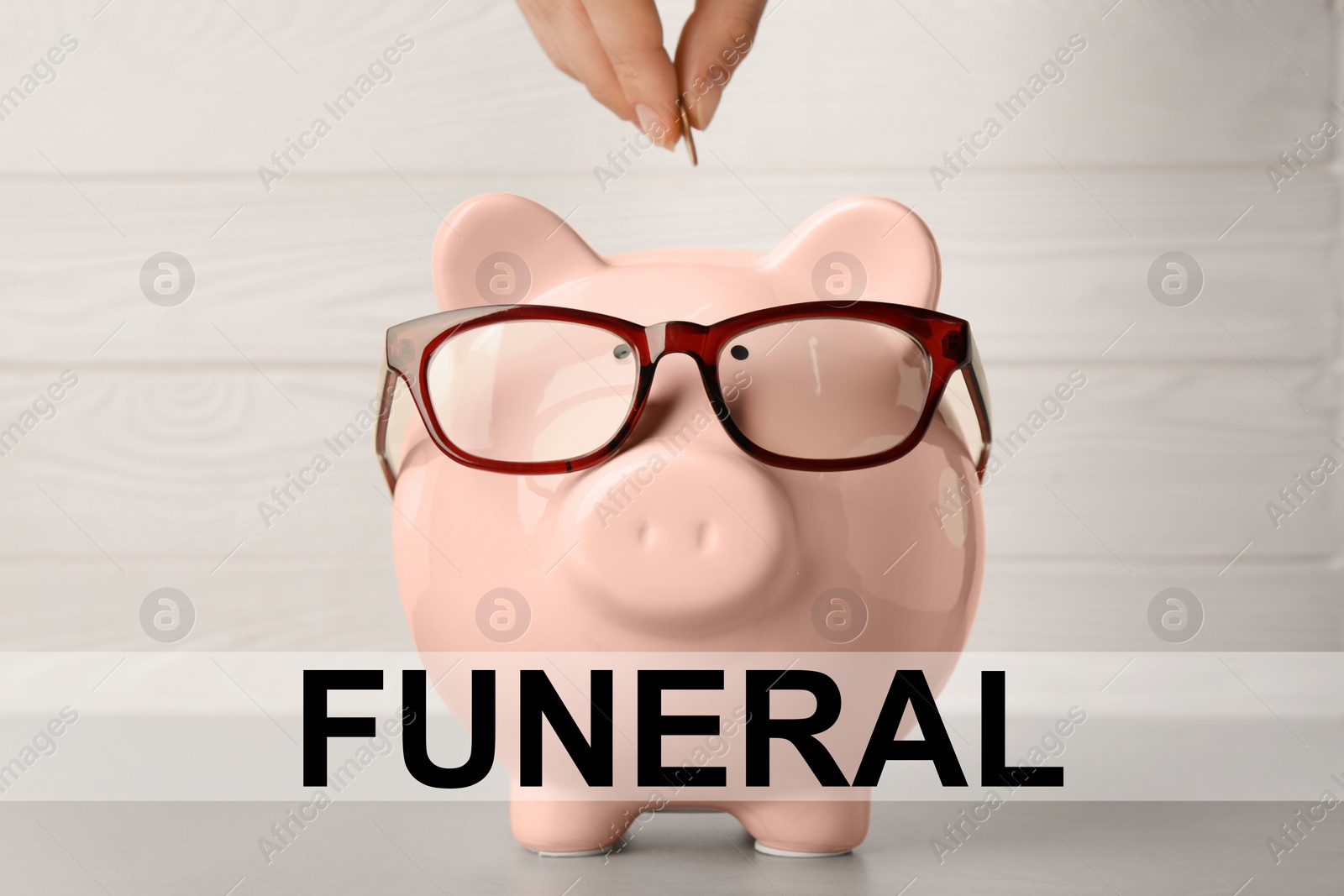 Image of Money for funeral expenses. Woman putting coin into piggy bank at light grey table, closeup