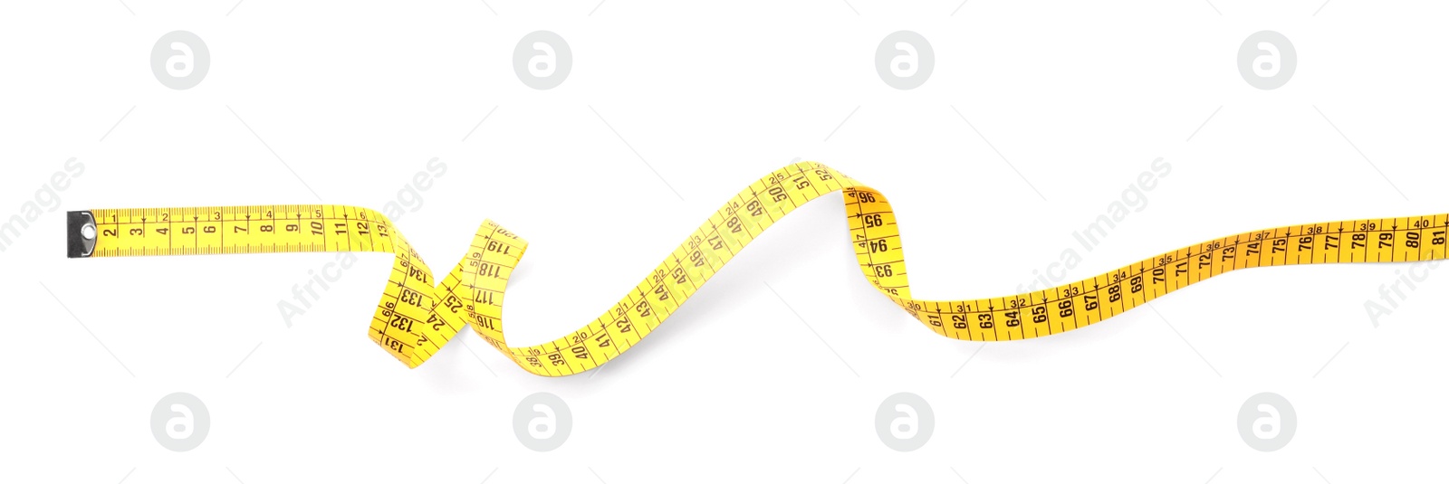 Photo of Long yellow measuring tape isolated on white, top view