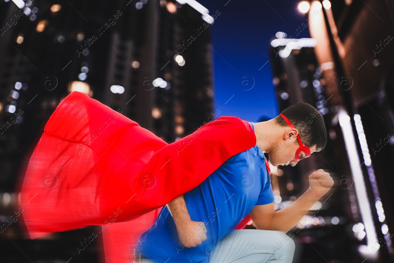Image of Man wearing superhero costume and beautiful cityscape in night on background