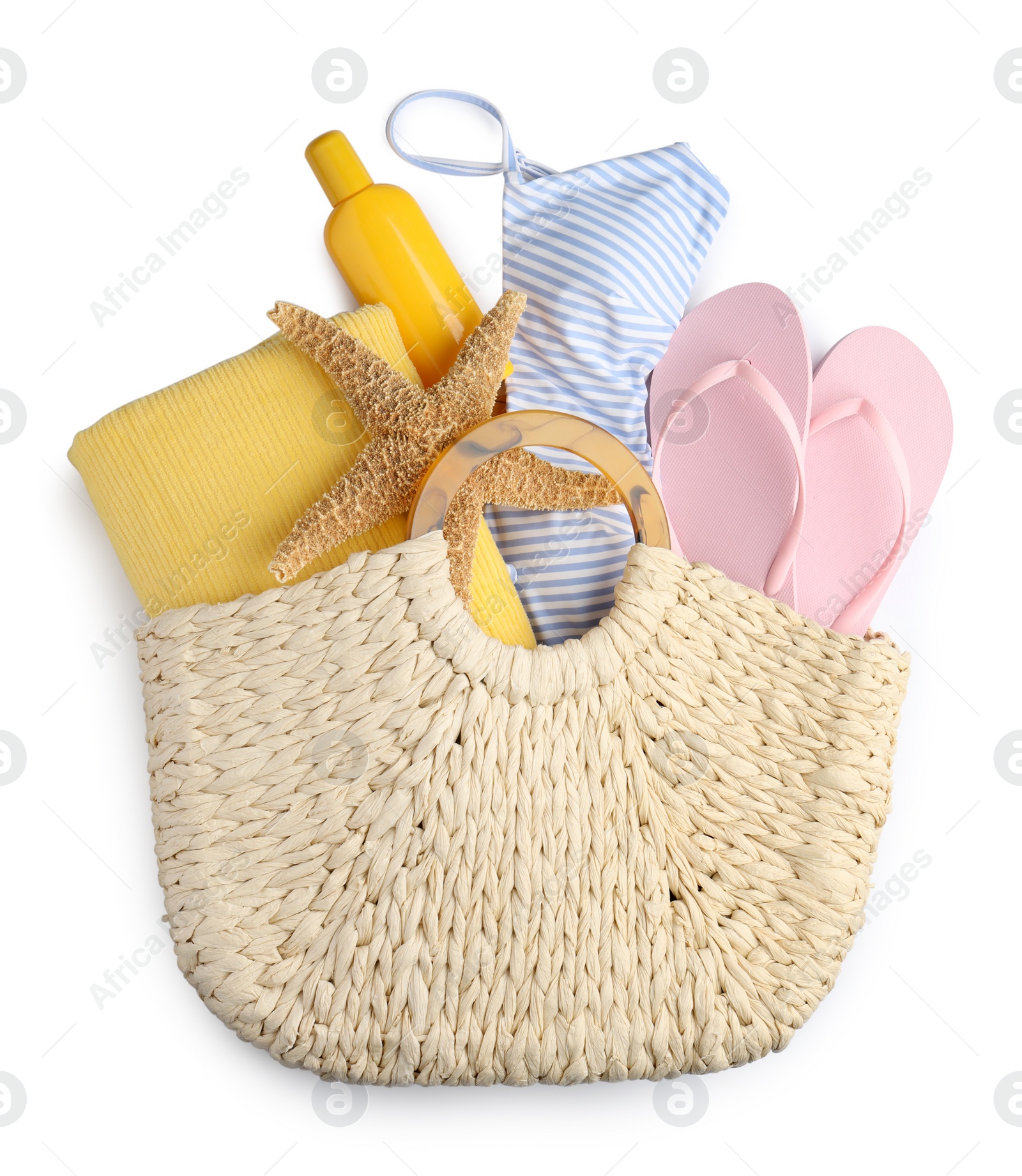 Photo of Stylish knitted bag with different beach accessories on white background, top view