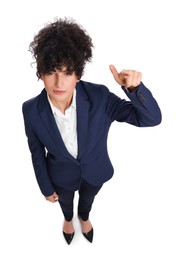 Beautiful businesswoman in suit pointing at something on white background, above view