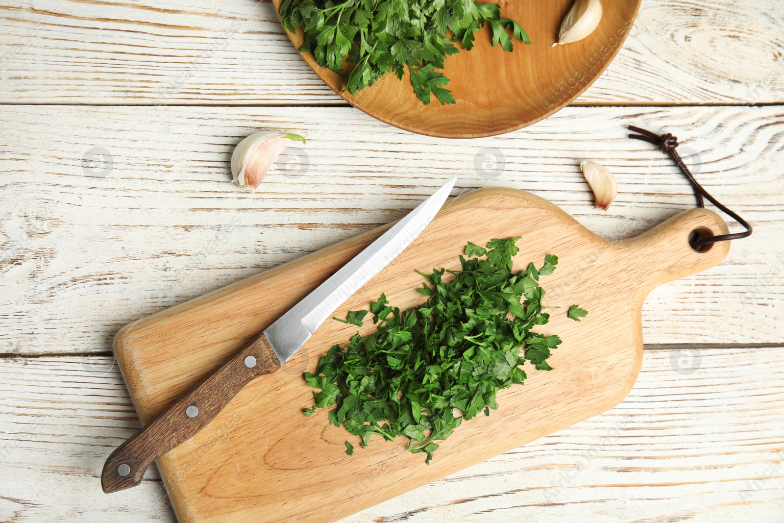 Photo of Flat lay composition with fresh green parsley on wooden background