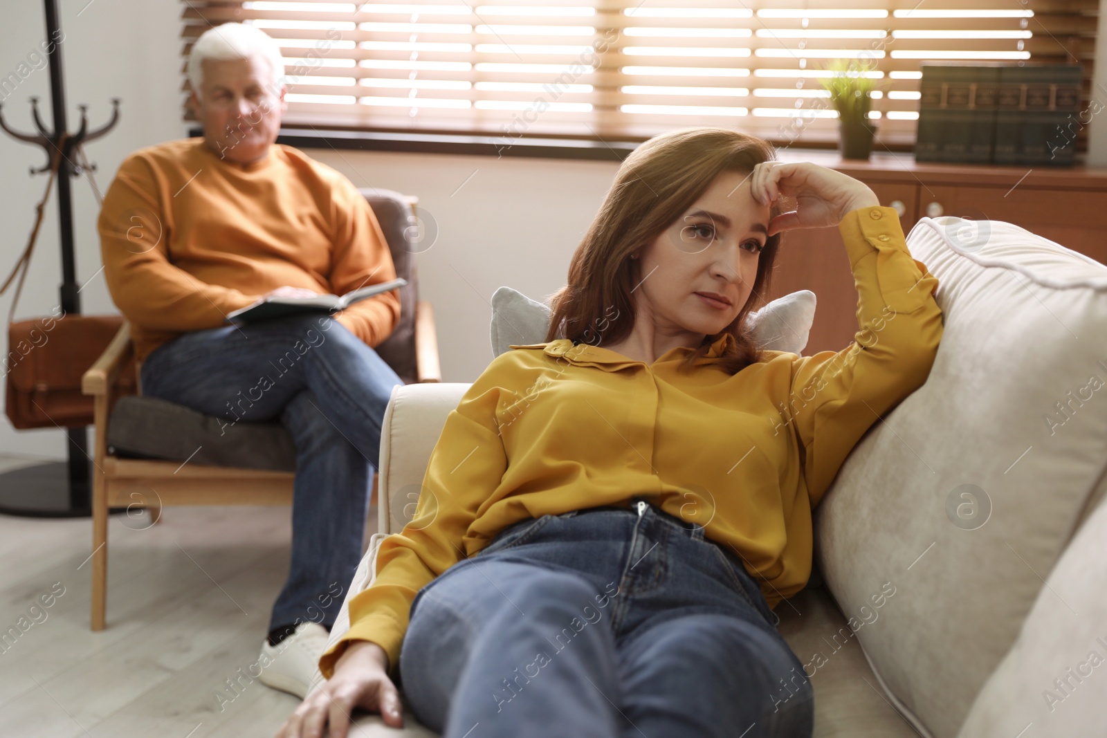 Photo of Professional psychotherapist working with patient in office