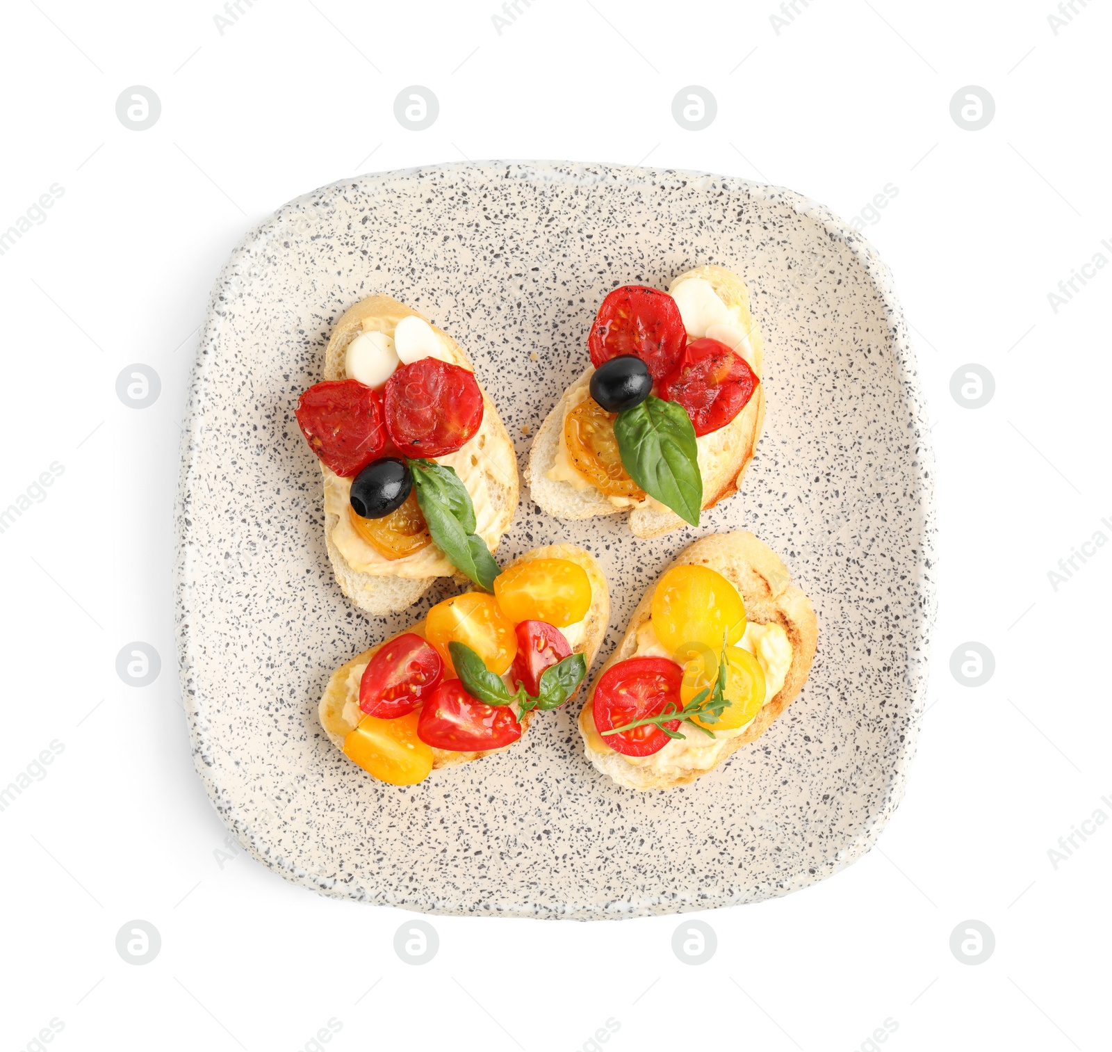 Photo of Plate of delicious tomato bruschettas on white background, top view