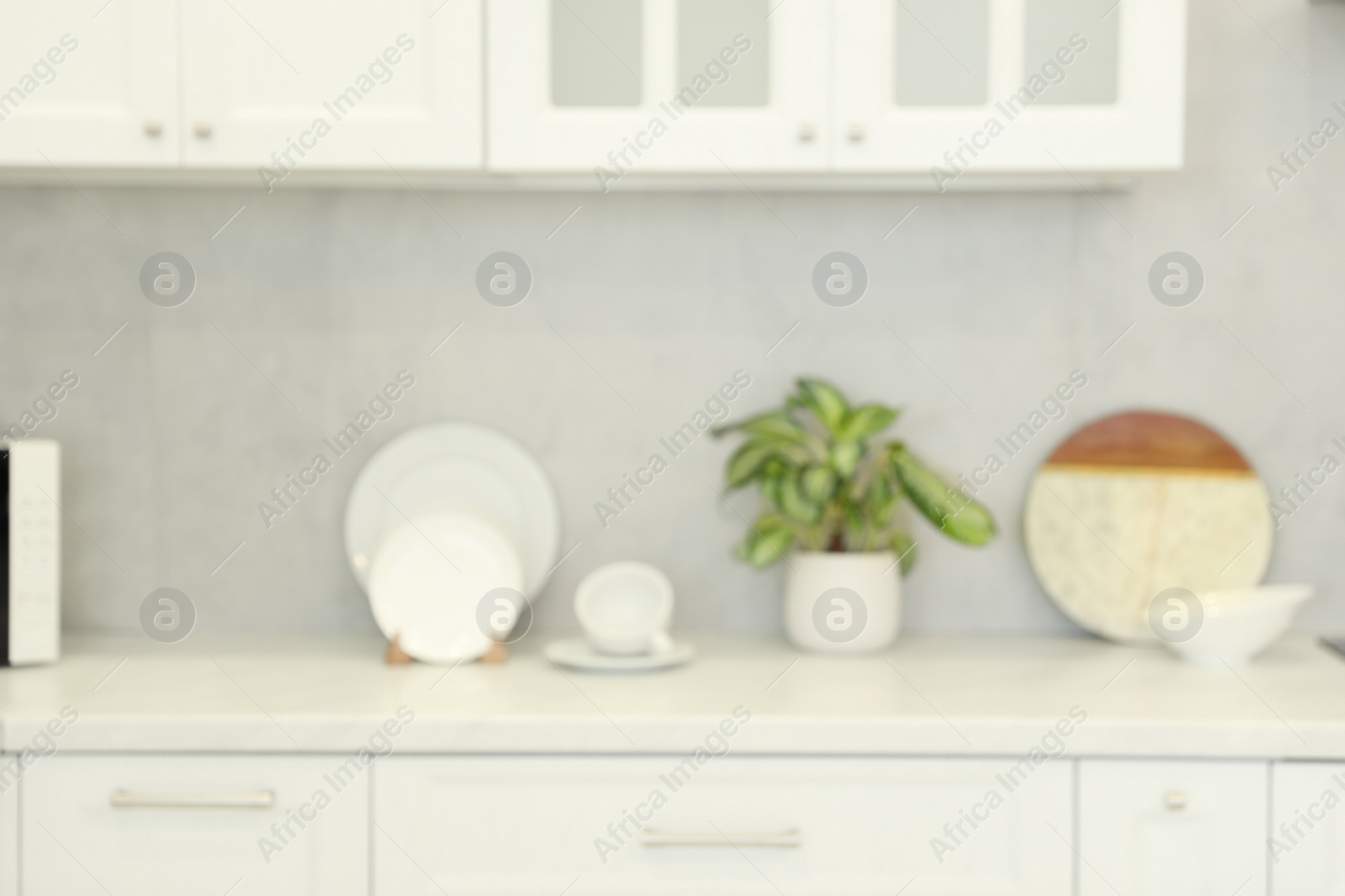 Photo of Blurred view of modern kitchen. Interior design