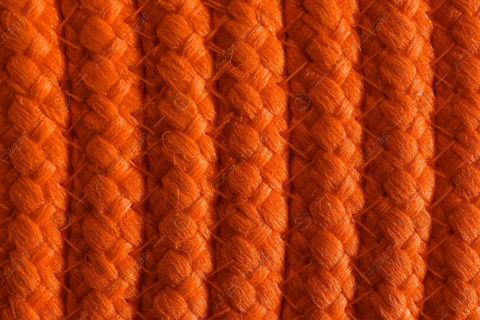 Photo of Texture of orange wicker mat as background, top view