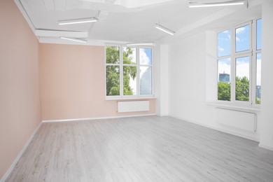 Photo of New empty room with clean windows and light walls