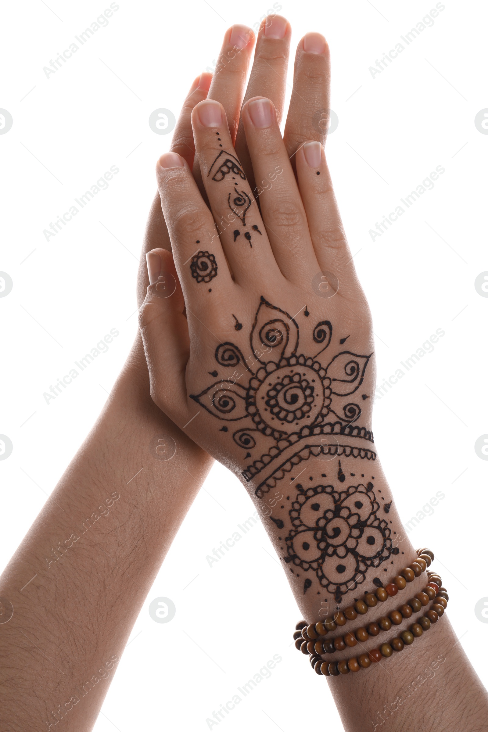 Photo of Woman with beautiful henna tattoo on hand against white background, closeup. Traditional mehndi