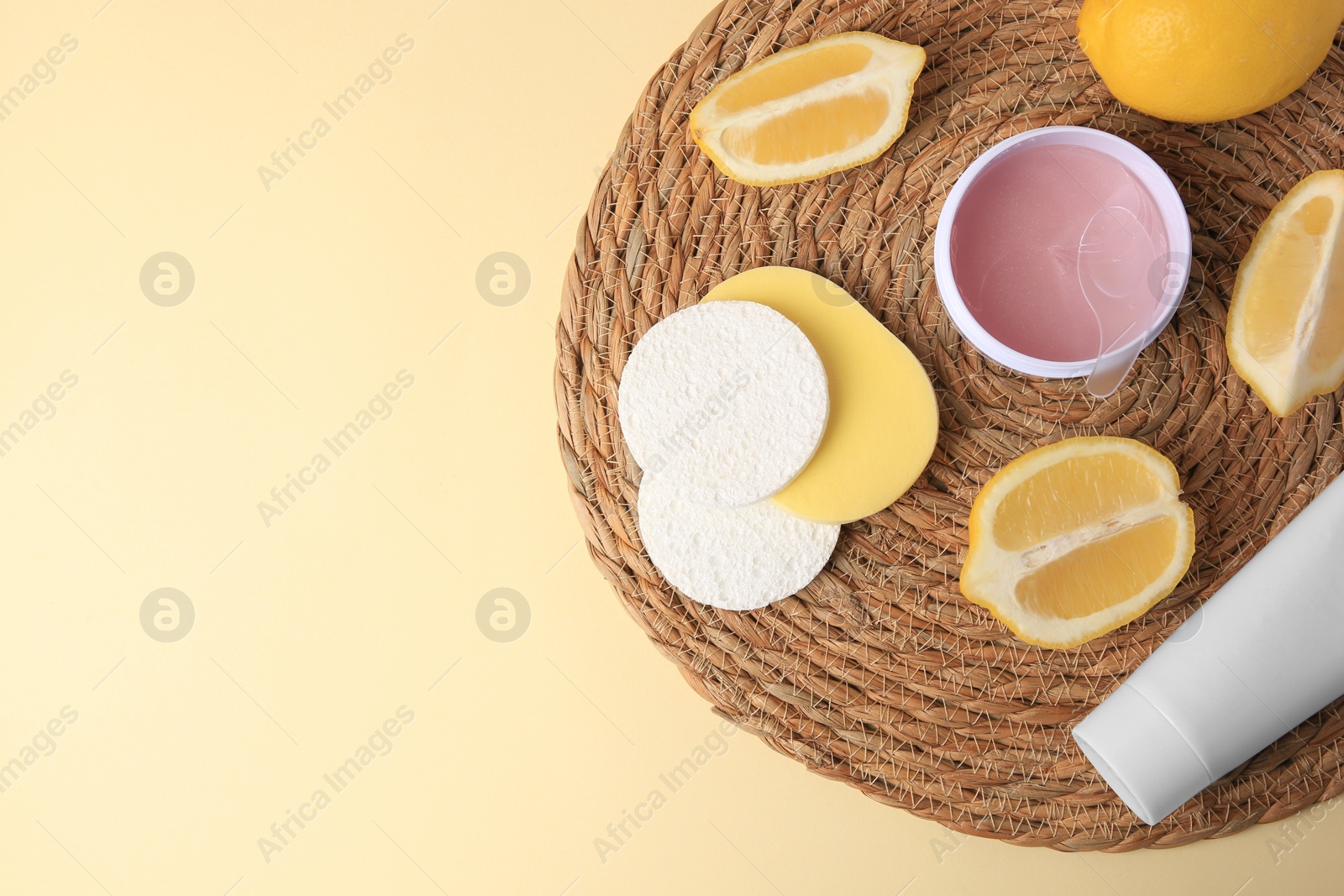 Photo of Lemon face wash. Fresh citrus fruits and personal care products on beige background, top view with space for text