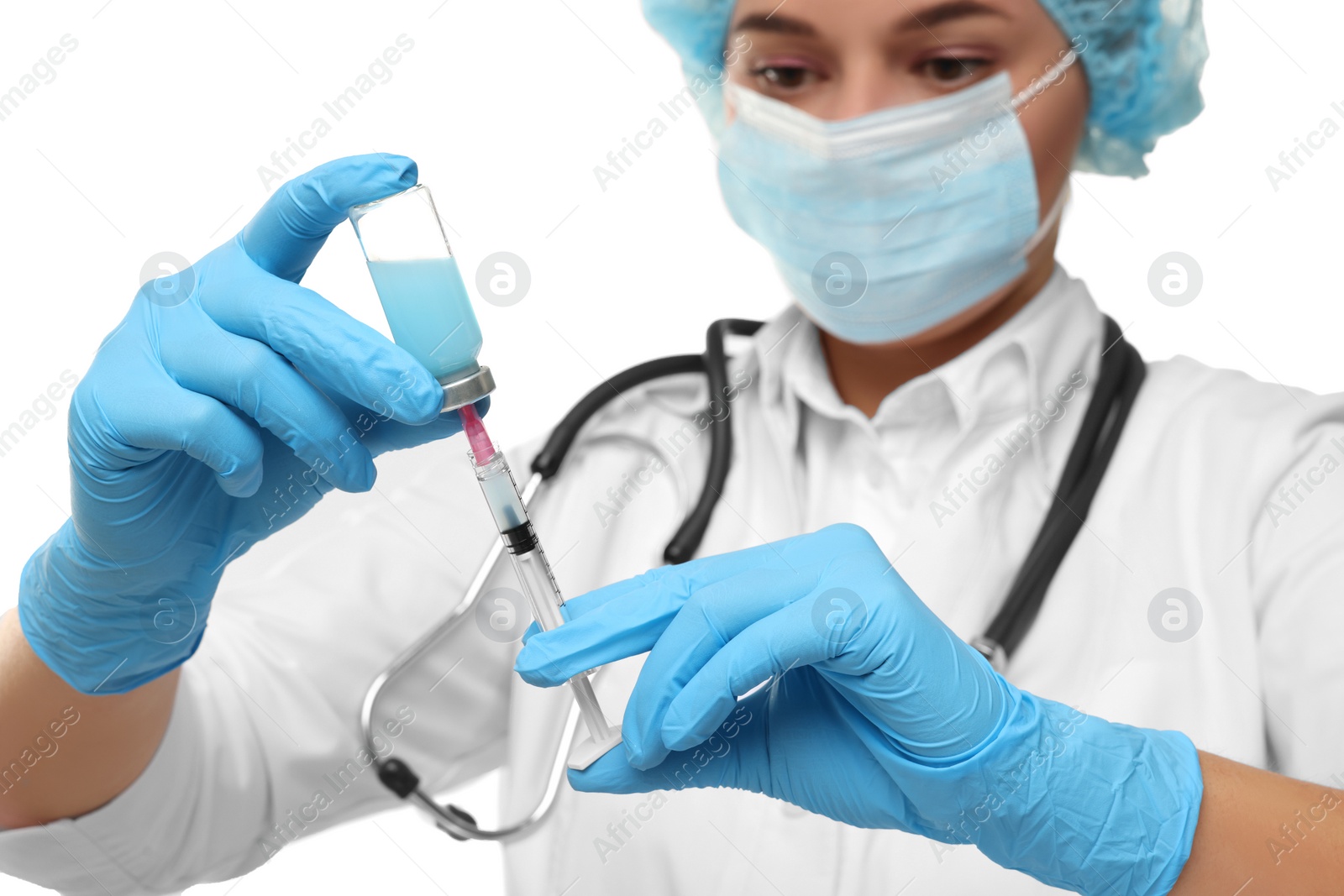 Photo of Doctor filling syringe with medication from glass vial on white background, selective focus