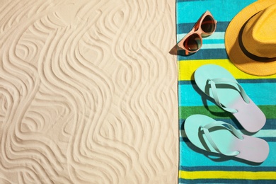 Photo of Flat lay composition with beach objects and space for text on sand