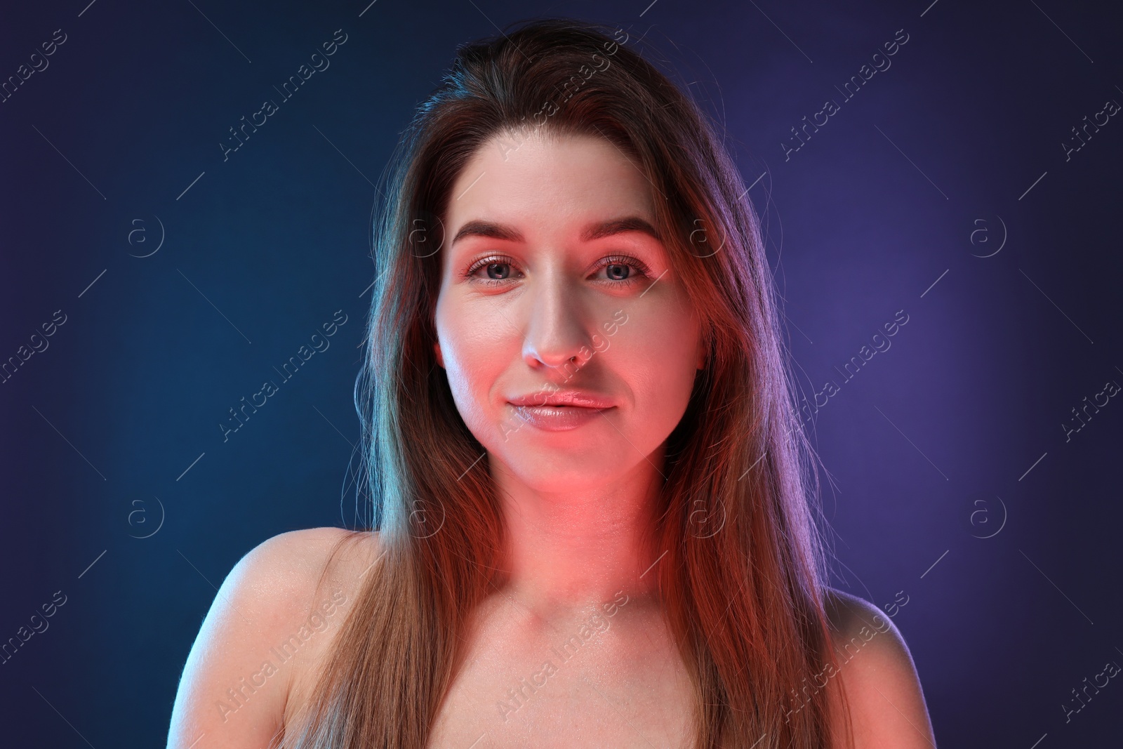 Photo of Portrait of beautiful young woman on color background