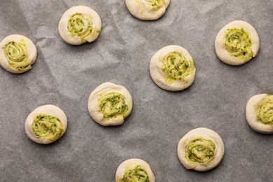 Photo of Raw puff pastry with tasty filling, top view