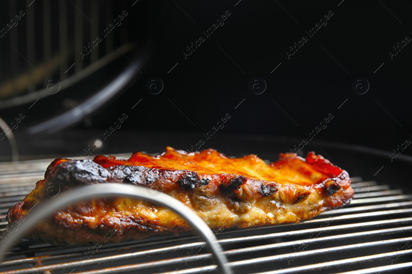 Photo of Delicious ribs on barbecue grill. Yummy meat