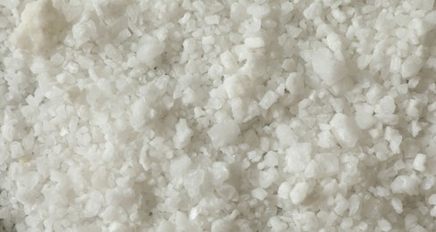 Photo of Organic sea salt as background, top view