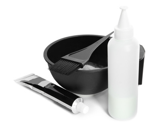 Photo of Professional tools for hair dyeing on white background