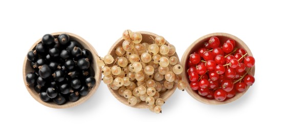 Photo of Fresh red, white and black currants in bowls isolated on white, top view