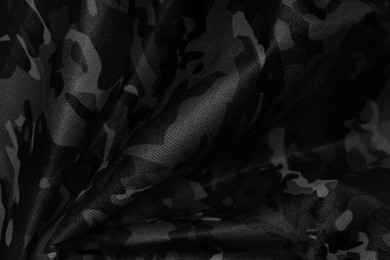 Image of Texture of crumpled camouflage fabric as background, top view. Black and white effect