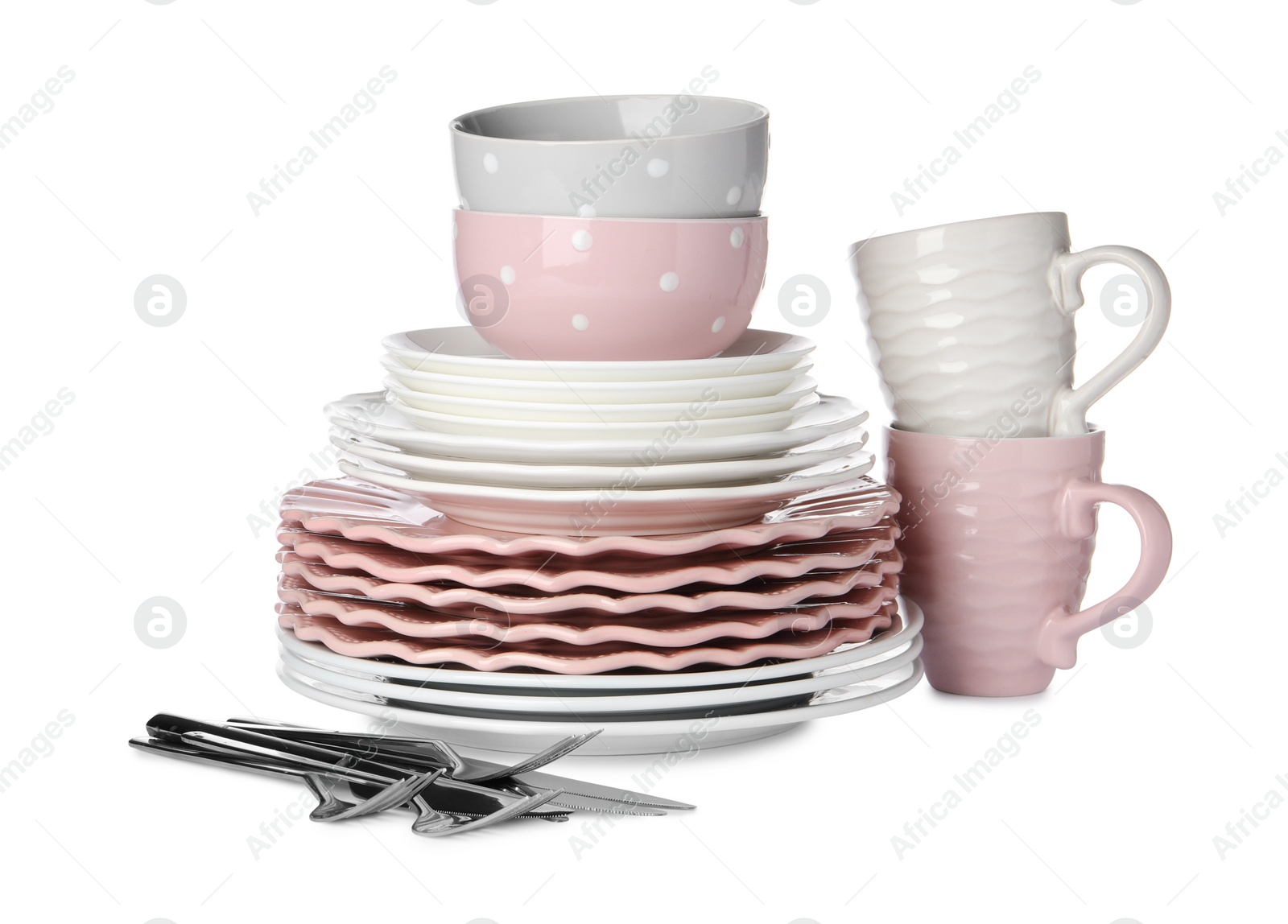 Photo of Set of beautiful ceramic dishware and cutlery isolated on white