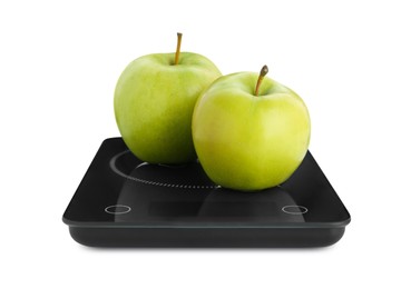 Photo of Electronic scales with ripe green apples on white background