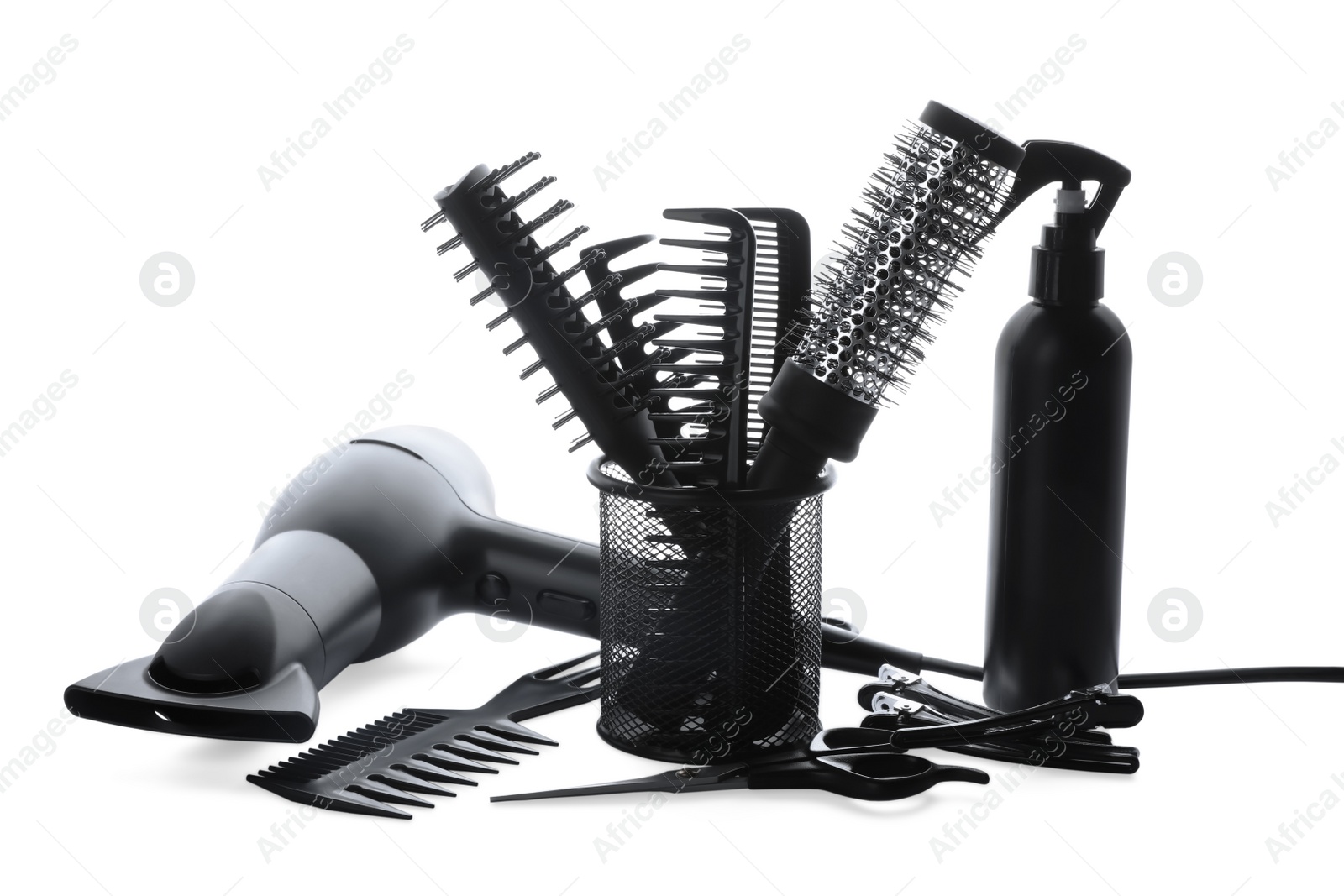 Photo of Different professional hairdresser tools on white background