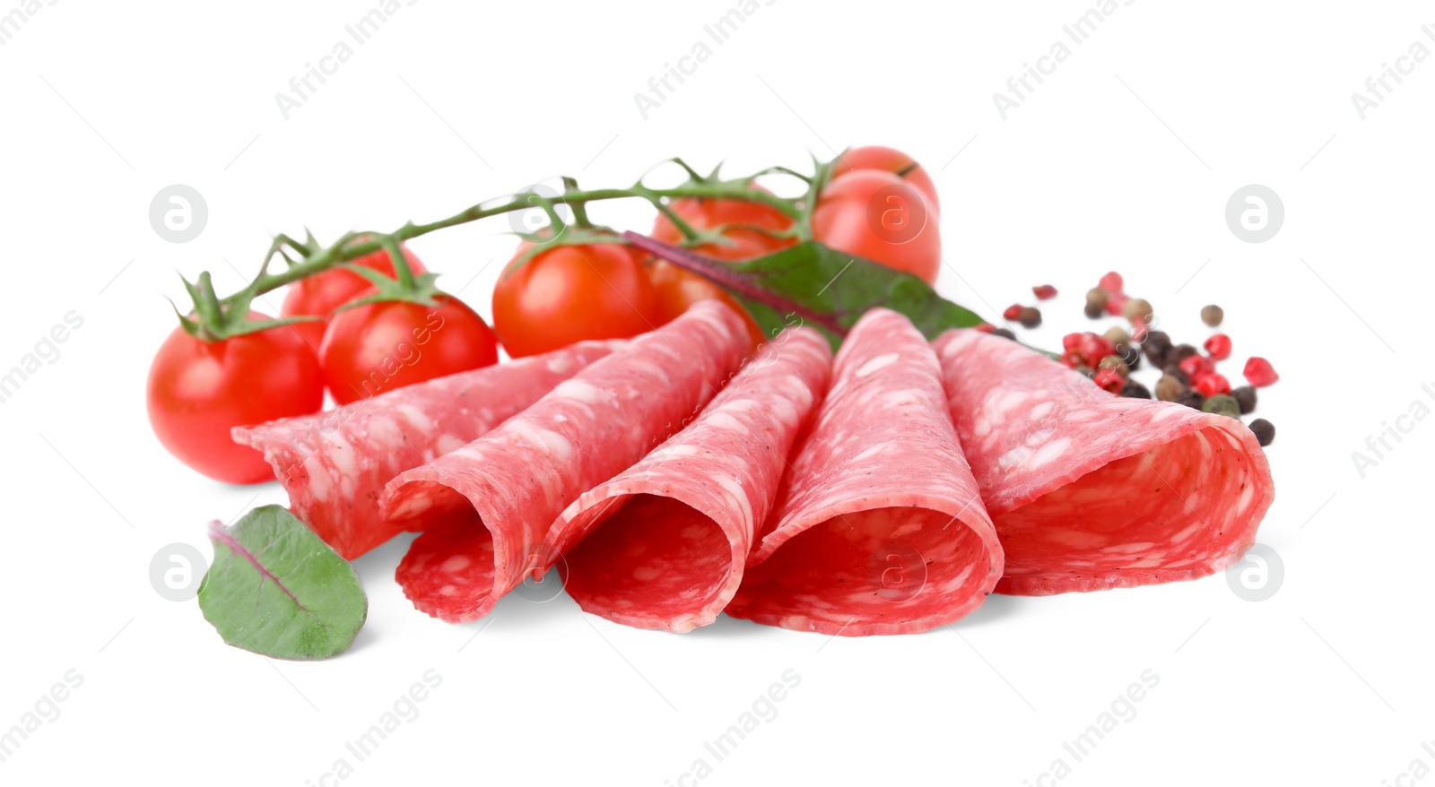 Photo of Slices of delicious salami, tomatoes, pepper and spinach isolated on white