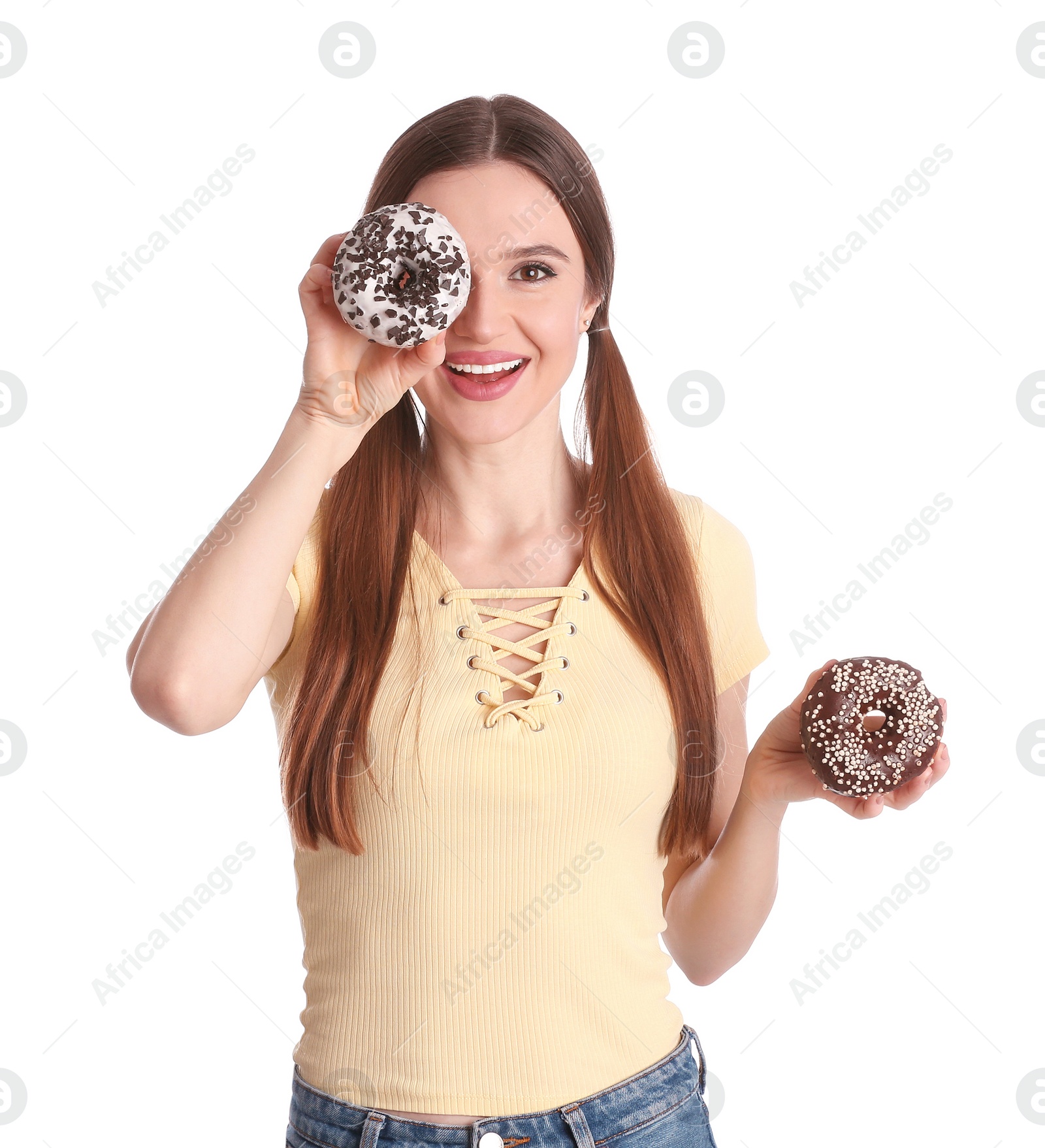 Photo of Beautiful young woman with donuts on white background