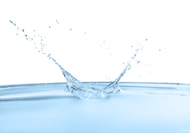 Photo of Splash of clear water on white background