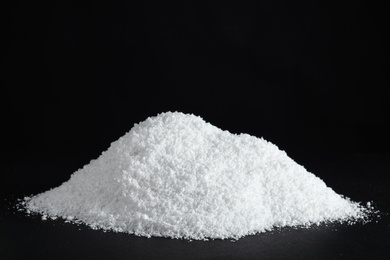 Photo of Heap of white snow on black background