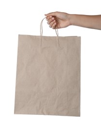 Woman holding shopping paper bag on white background