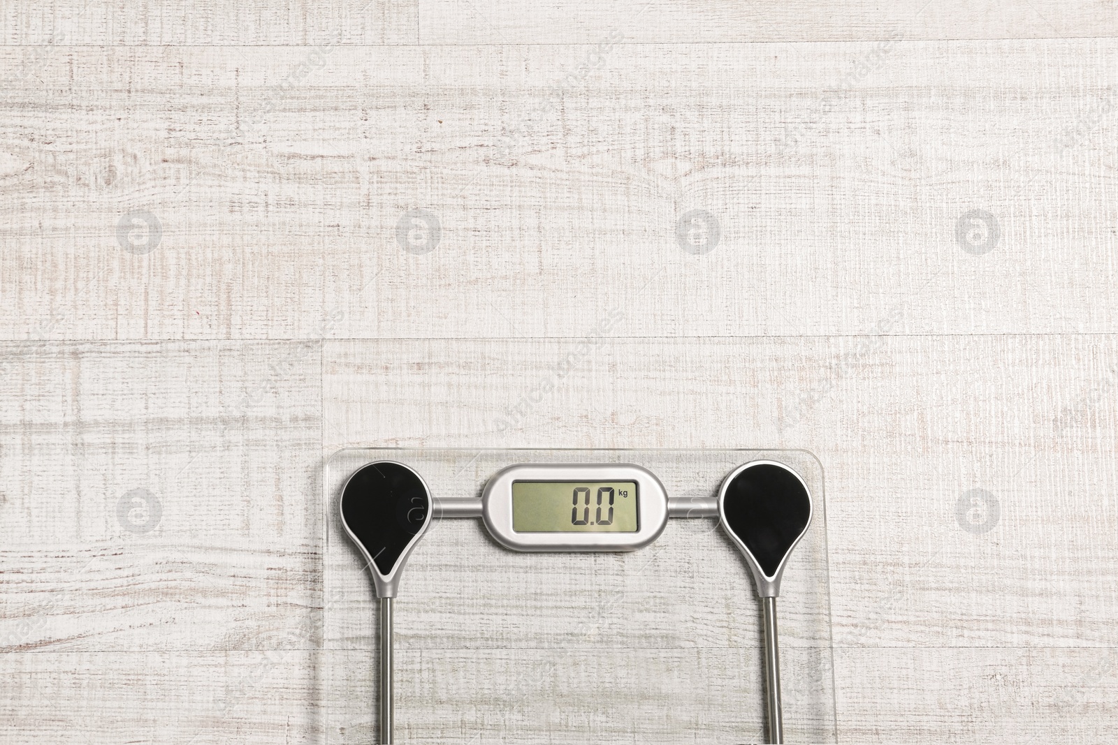 Photo of Bathroom scales and space for text on wooden background, top view. Weight loss concept