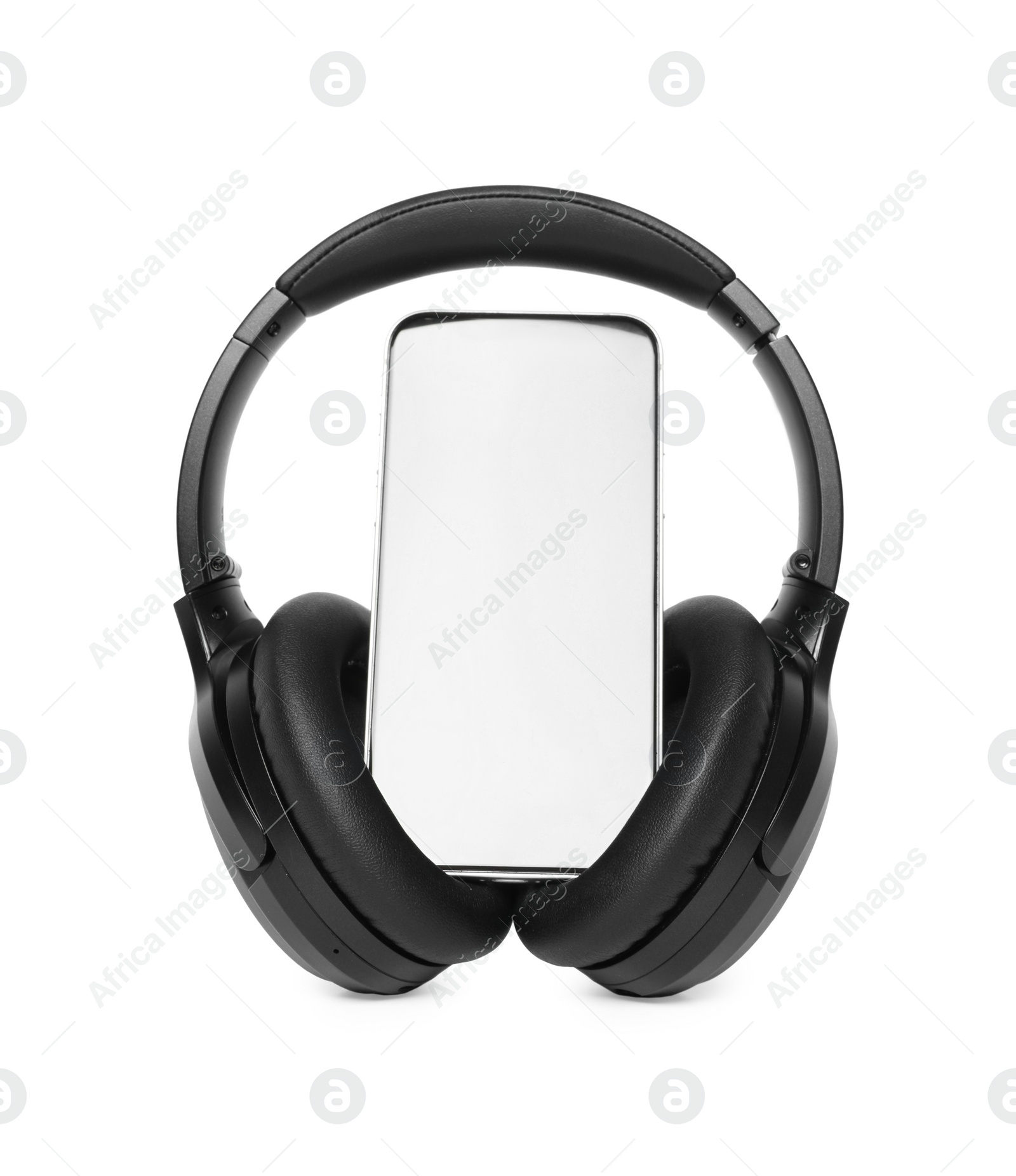 Photo of Modern wireless headphones and smartphone isolated on white