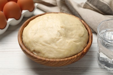 Photo of Cooking scones with soda water. Dough and ingredients on white wooden table