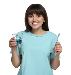 Photo of Young woman with mouthwash and toothbrush on white background