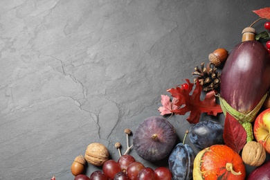 Flat lay composition with autumn vegetables and fruits on grey background, space for text. Happy Thanksgiving day