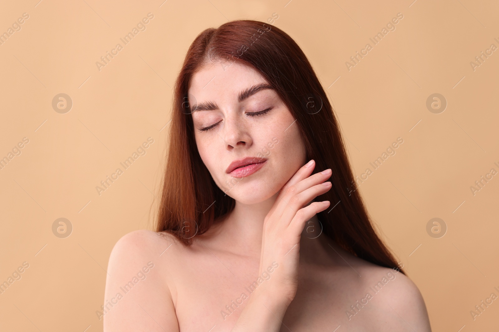 Photo of Portrait of beautiful woman on beige background