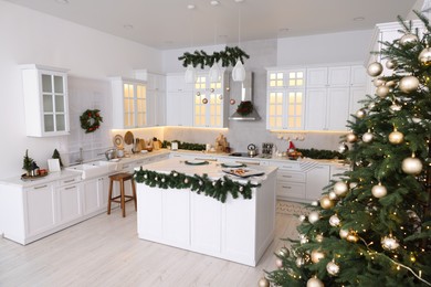 Cozy spacious kitchen decorated for Christmas. Interior design