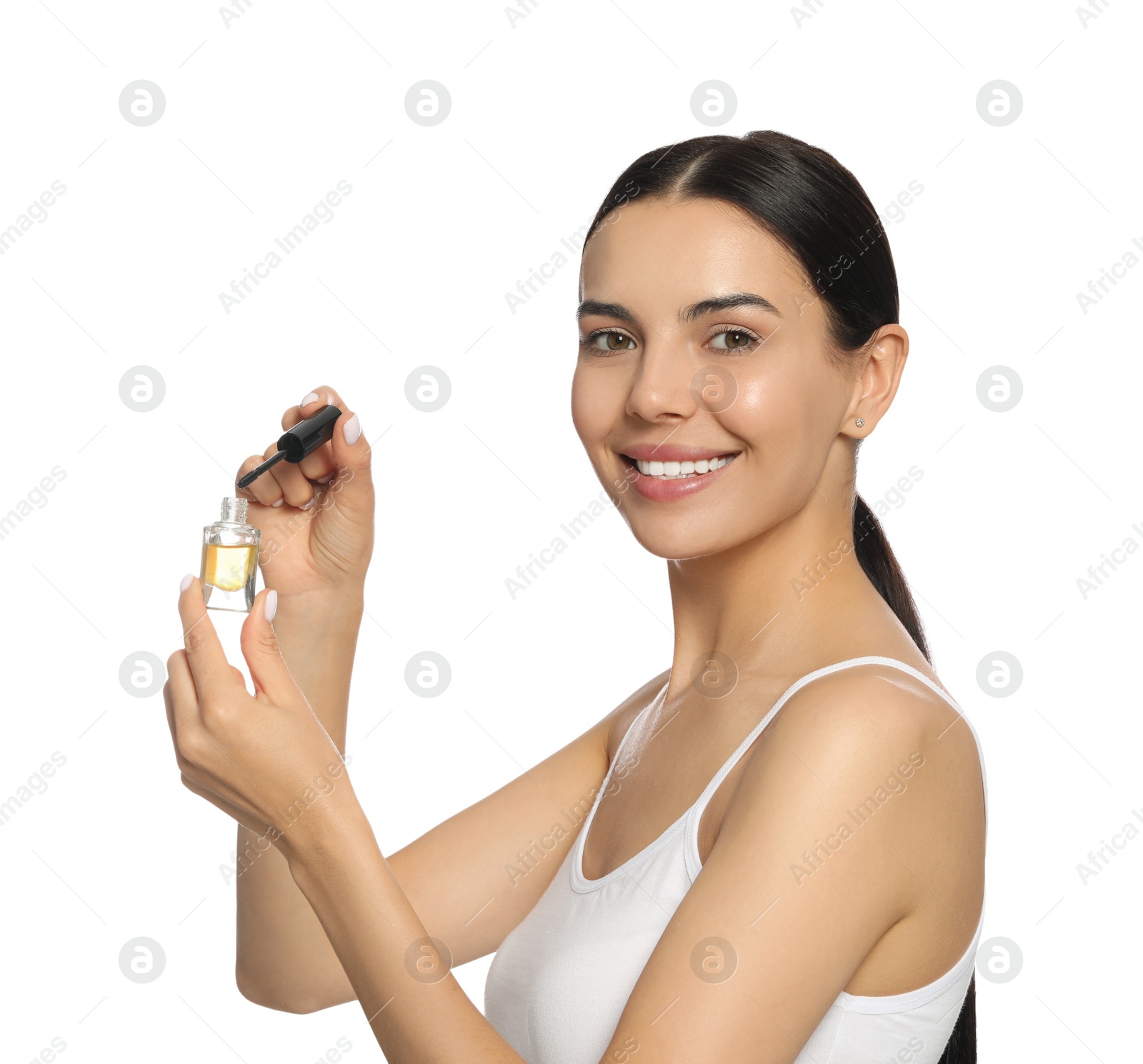 Photo of Young woman with eyelash oil on white background