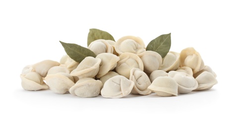 Photo of Raw meat dumplings with bay leaves on white background