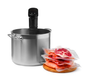 Photo of Thermal immersion circulator in pot and meat on white background. Vacuum packing for sous vide cooking