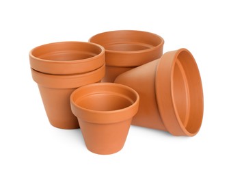 Photo of Empty clay flower pots isolated on white