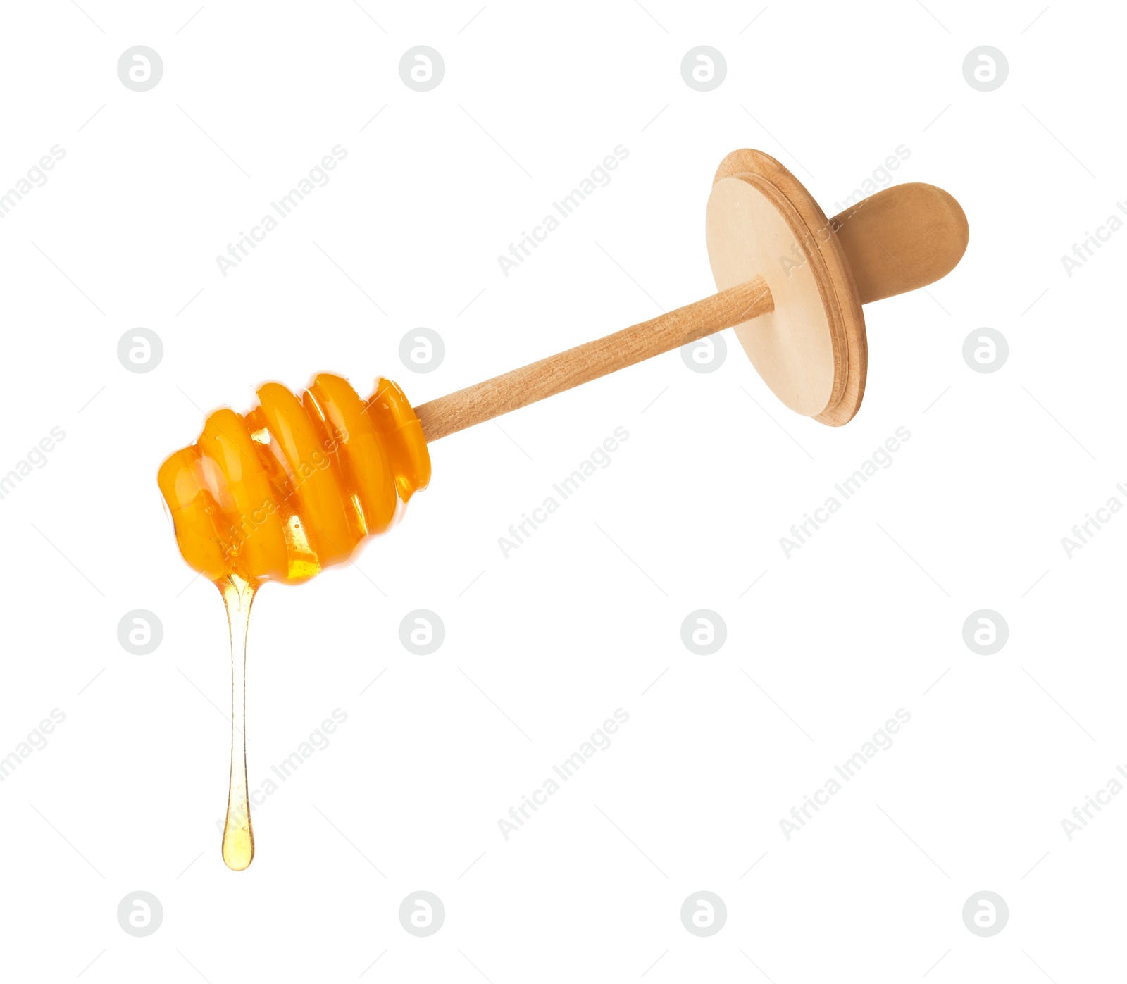 Photo of Honey dripping from dipper isolated on white