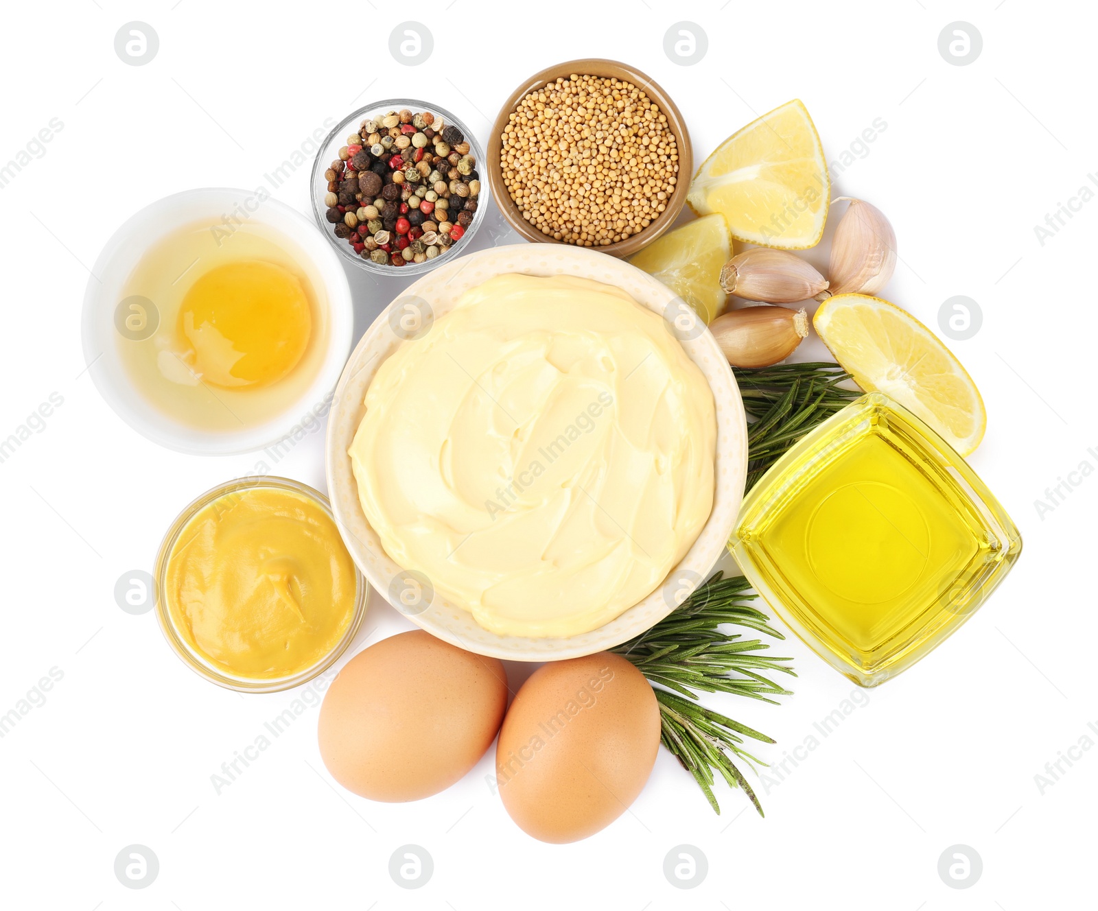 Photo of Bowl with fresh mayonnaise and ingredients on white background, top view